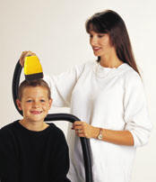 Mother and boy using flowbee